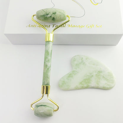 White Jade Facial Roller & Gua Sha Set paired with facial oil for skincare routine